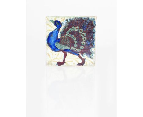 A good William De Morgan Late Fulham Period triple lustre Strutting Peacock tile, painted displaying in shades of blue, ruby 