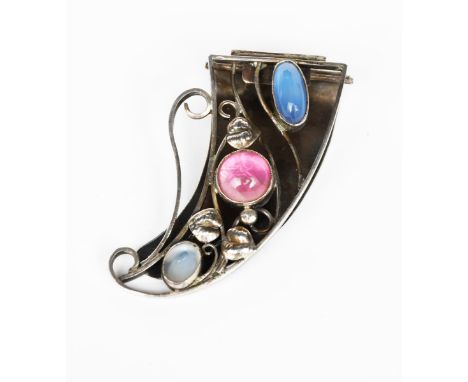 A George Hunt silver cornucopia clip brooch,  with scrolling wirework and foliage, set with central pink foil backed cabochon