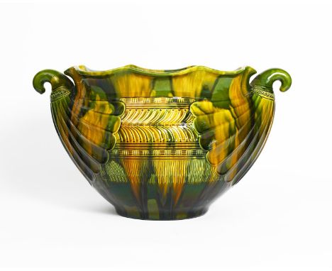A large Ault Pottery jardniere designed by Dr Christopher Dresser, shouldered ovoid form with fluted rim and pulled handles, 
