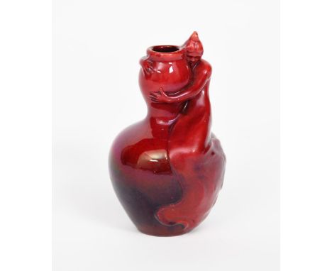 An Art Nouveau Zsolnay Pecs pottery miniature vase,  cast with an Art Nouveau maiden sitting on the ovoid body her arms wrapp