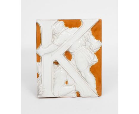 A pottery architectural tile designed by Godfrey Sykes, probably Minton's rectangular cast in relief with a medieval figure a
