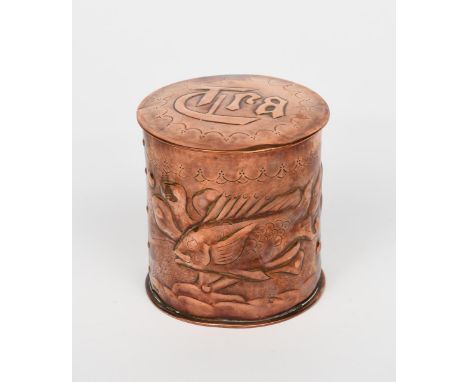 A Newlyn Industrial Classes copper tea caddy and cover, cylindrical, hammered in low relief with scaly fish swimming past wat