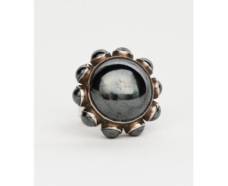 A Georg Jensen silver and hematite ring designed by Astrid Fog,  model no.166, central hematite dome with smaller domed borde