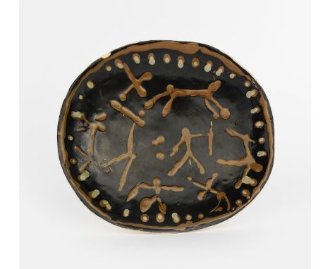 ‡Ian Godfrey (1942-1997) an early platter, dated 1957, rounded, rectangular form slip decorated in mushroom on a burnt umber 