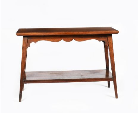 An Aesthetic Movement Druce &amp; Co oak hall table,  rectangular top on four flaring, tapering square section legs, low shel