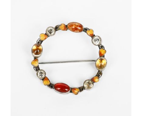A silver and enamel brooch by George Hunt,  the circular body with applied wirework leaves enamelled orange and red, set with