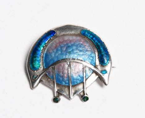 A Secessionist James Fenton silver and enamel brooch, circular cast in low relief, enamelled pale blue and pink, the tendrils