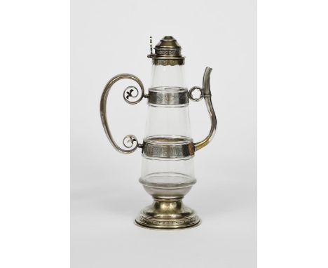 A Gothic Revival silver mounted glass wine jug designed by William Butterfield, the stepped silver foot with engraved overlap