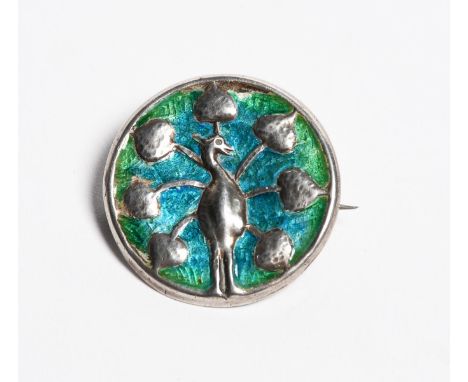 A Liberty &amp; Co Cymric silver and enamel brooch, cast in low relief with a peacock, enamelled blue and green stamped marks