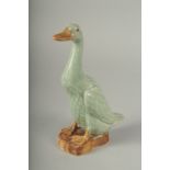 A CHINESE REPUBLIC PERIOD CELADON PORCELAIN FIGURE OF A DUCK, with impressed mark to base, 20.5cm