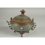 A CHINESE CHAMPLEVE ENAMEL CLOISONNE CENSER AND COVER, raised on tripod legs, 15cm high.