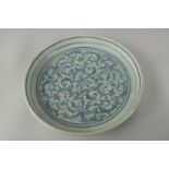 A LATE 19TH CENTURY CHINESE BLUE AND WHITE PORCELAIN DISH, painted with floral motifs, 19cm