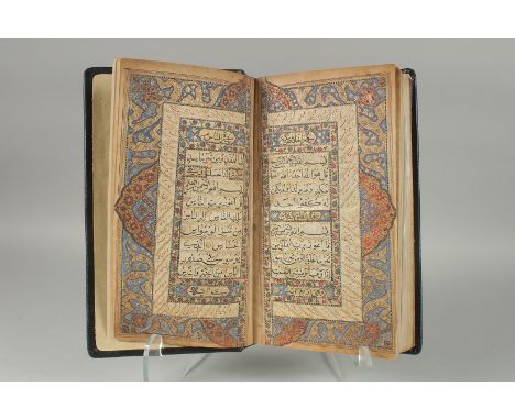A 19TH CENTURY NORTH INDIAN KASHMIR LEATHER BOUND ILLUMINATED QURAN, the manuscript written in naskh in black ink within gold