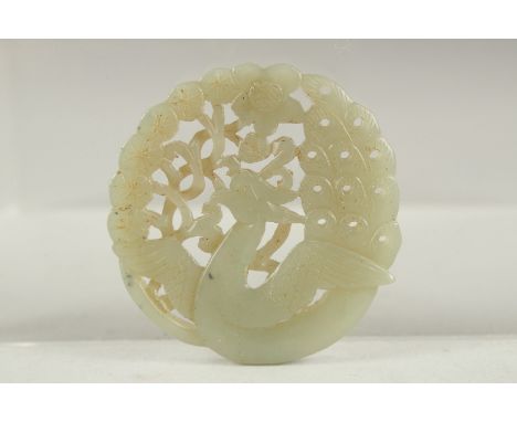 A FINE 19TH-EARLY 20TH CENTURY CHINESE CARVED JADE ROUNDEL, 5.5cm wide.