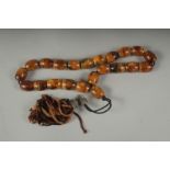 A STRING OF PRAYER BEADS.