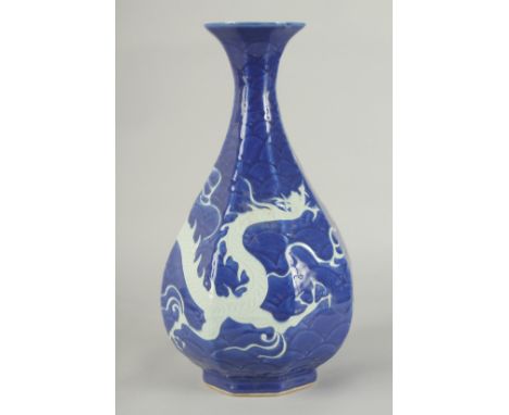 A CHINESE SACRIFICIAL BLUE AND WHITE PORCELAIN DRAGON YUHUCHUNPIN VASE, with carved scale pattern, 34cm high.