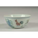 A CHINESE DOUCAI PORCELAIN CHICKEN CUP, 8.5cm diameter.