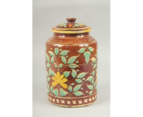 A FINE AND UNUSUAL EARLY 19TH CENTURY MUGHAL INDIAN LIDDED POTTERY ALBARELLO, with Persian calligraphy, 26cm high.