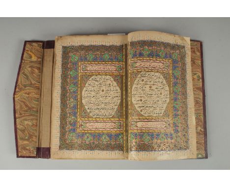 AN 18TH CENTURY OTTOMAN LEATHER BOUND ILLUMINATED QURAN, the manuscript written in naskh in black ink and ruled in red and go