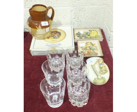 A Doulton Lambeth jug with applied rustic scene decoration, 16.5cm high, two Goebel Hummel wall plaques, a wall pocket and a 