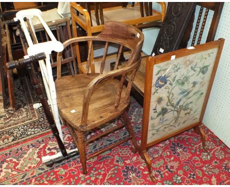A rush-seated carver chair with bobbin-turned front legs, an elm armchair, two wooden towel rails, a magazine stand, a nest o