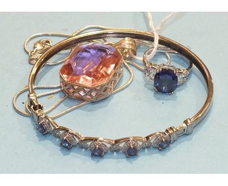 A synthetic sapphire and cubic zirconia silver-mounted ring, a similarly-set bangle and a silver pendant, (3).