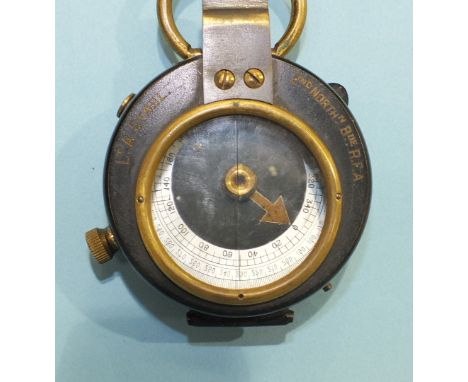 A Negretti & Zambra prismatic compass, 5cm, etched 'Lt A Stahl, 2nd Northn BDE RFA' on front, in leather case and a carving k