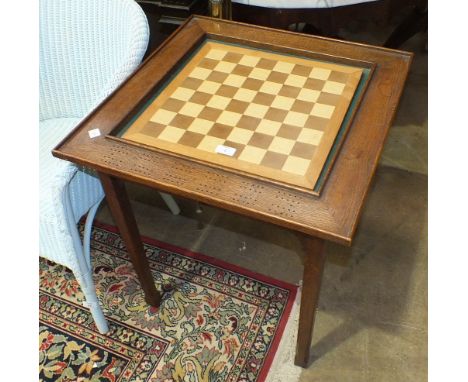 An oak Euchre or Cribbage table with central baize and pierced border score boards, 60cm, a leather-covered stool, one other 