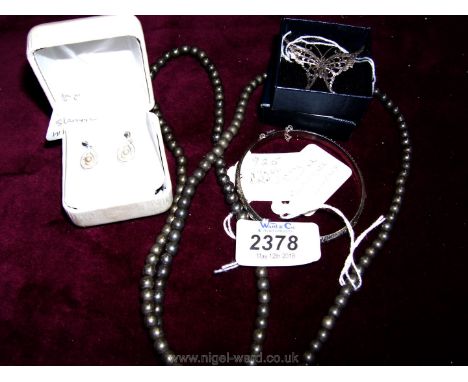 A pair of silver HM pearl Earrings, a 34" grey pearl necklace, a .925 silver bracelet and a .925 silver butterfly brooch