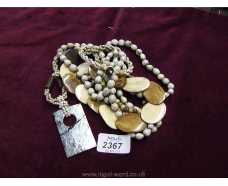 A vintage bone necklace and two other bead necklaces