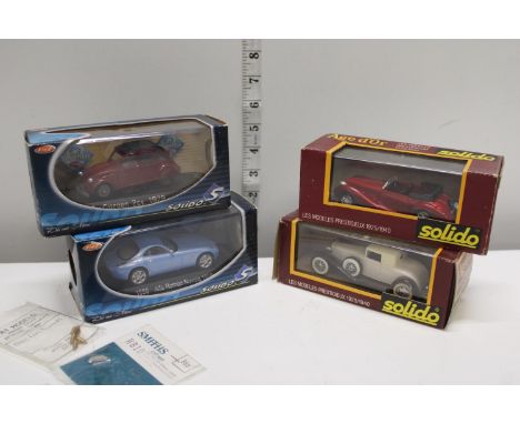 Four boxed Solido die-cast models 