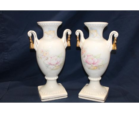 A pair of Staffordshire ceramic urns 