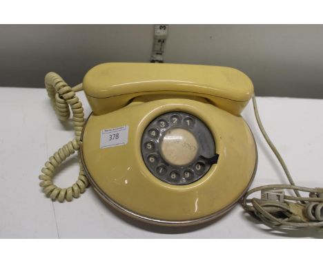 A vintage yellow telephone 