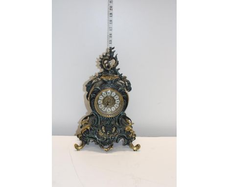 A cast metal vintage mantel clock converted for battery use 