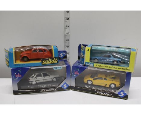 Four boxed Solido die-cast models 