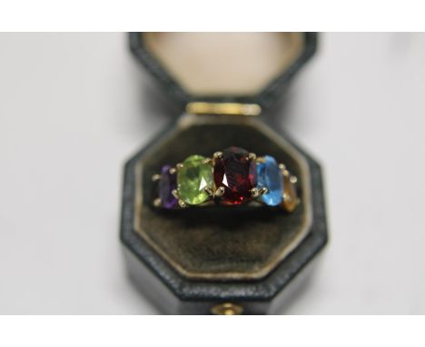 A 9ct gold multi coloured stone ring 