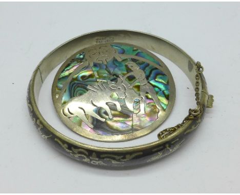 A silver niello bangle and a silver and abalone pendant or brooch, 29.2g