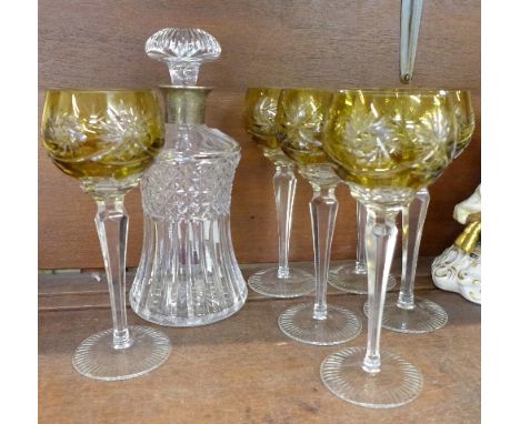 A silver rimmed thistle shaped decanter and six hock glasses, two with small chip to rim