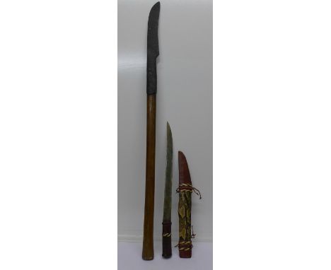 A scythe and a knife with snakeskin scabbard