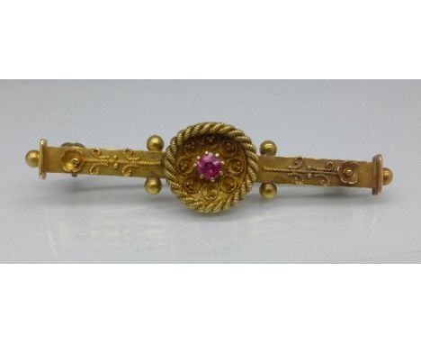 A 15ct gold and ruby brooch, 3.1g