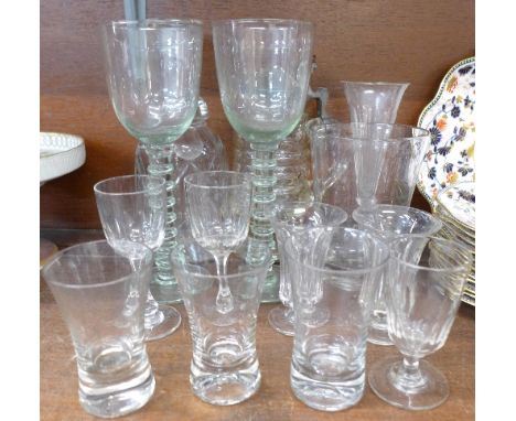 A collection of Victorian and later drinking glasses, a decanter, a stein with faceted glass lid and body, a pair of pale gre