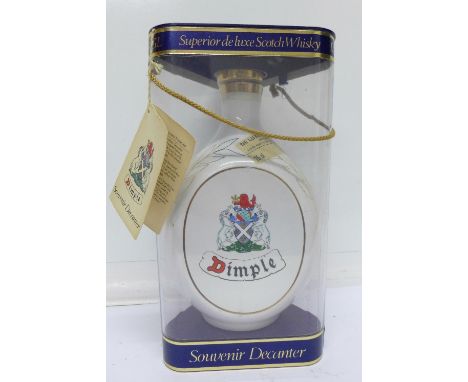 A souvenir Dimple De Luxe Scotch Whisky decanter celebrating 1986 Commonwealth Games in Edinburgh