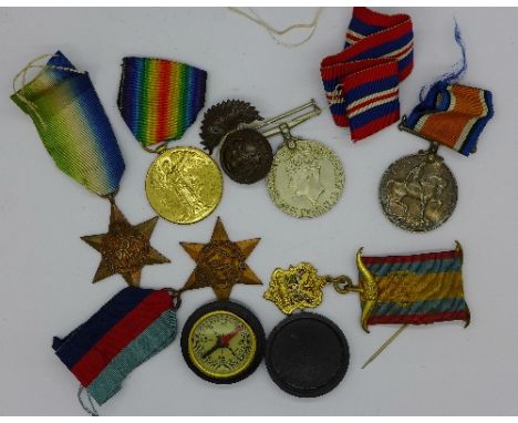 Two WWI medals to 2nd Lieut. H.C. Stanley, three WWII medals, a Lodge badge and a compass