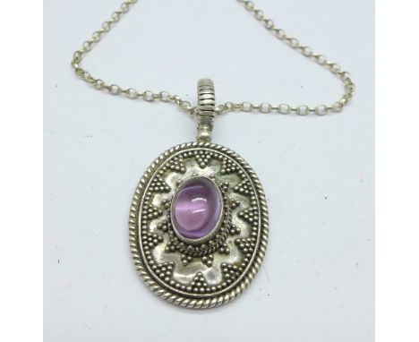A 925 silver and amethyst pendant on a 60cm silver chain, the pendant marked Suarti