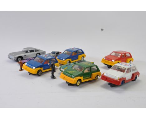 A group of Scalextric Metro Racing Cars and other items. 