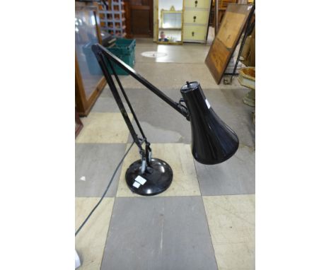 A black metal anglepoise lamp 