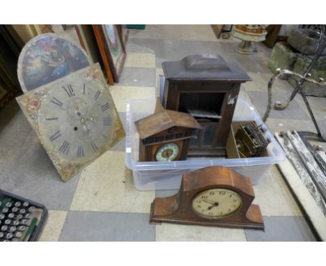 A box of assorted clock parts, including clock dials, movement, etc. 