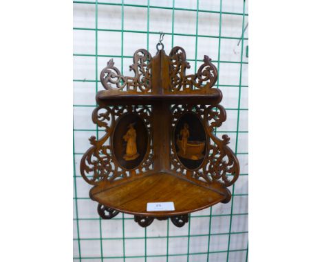 A small Italian inlaid and carved olivewood corner wall bracket 