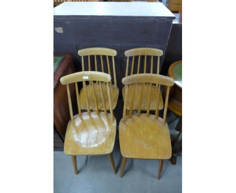 A set of four Ercol style beech kitchen chairs 