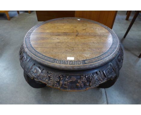 A 19th Century Chinese carved elm circular opium table 